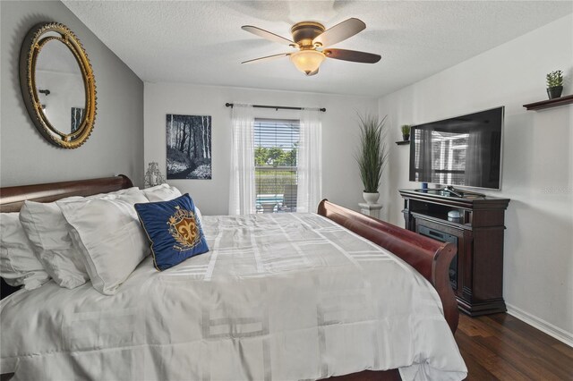 4758 Breezy Pines Blvd, Sarasota, FL 34232 - bedroom featuring dark wood-type flooring, a textured ceiling, ceiling fan, and baseboards