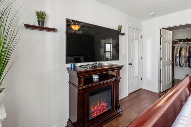 4758 Breezy Pines Blvd, Sarasota, FL 34232 - interior space with dark wood-style floors, baseboards, and a glass covered fireplace