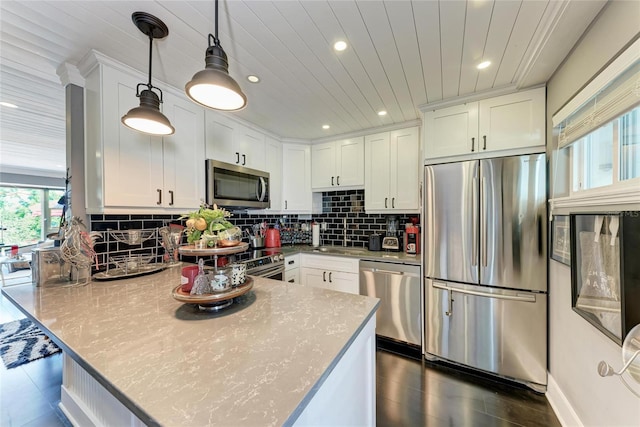 33 S Gulfstream Ave Unit 306, Sarasota, FL 34236 - kitchen featuring appliances with stainless steel finishes, a peninsula, white cabinets, recessed lighting, and backsplash