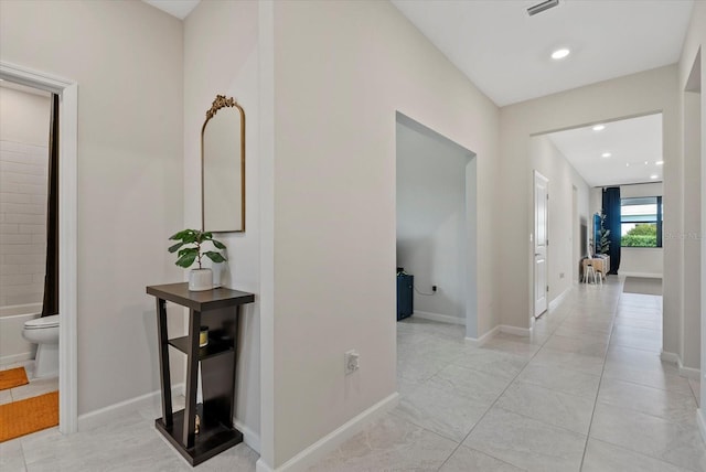 26000 Seastone Dr, Englewood, FL 34223 - corridor with light tile patterned floors, recessed lighting, and baseboards