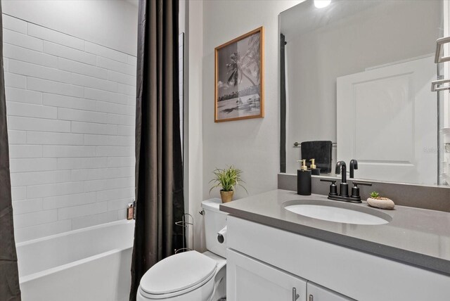 26000 Seastone Dr, Englewood, FL 34223 - full bath with vanity, toilet, and shower / bath combo with shower curtain