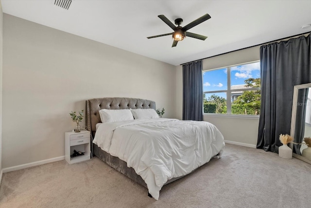 26000 Seastone Dr, Englewood, FL 34223 - bedroom with light carpet, baseboards, and ceiling fan