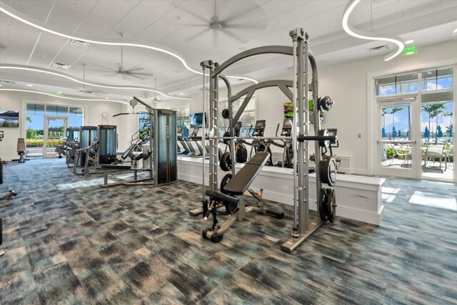 26000 Seastone Dr, Englewood, FL 34223 - exercise room featuring ceiling fan, french doors, and wood finished floors