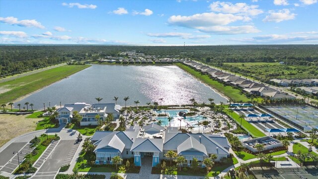 26000 Seastone Dr, Englewood, FL 34223 - aerial perspective of suburban area with a large body of water and a heavily wooded area