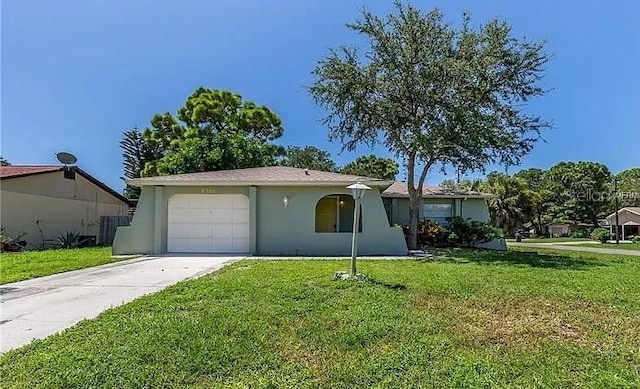 8730 Filson Pl, Sarasota, FL 34231 - ranch-style house featuring driveway, a front lawn, an attached garage, and stucco siding