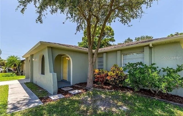 8730 Filson Pl, Sarasota, FL 34231 - view of front facade with stucco siding