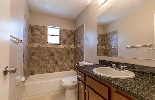8730 Filson Pl, Sarasota, FL 34231 - bathroom with vanity, tub / shower combination, toilet, a textured ceiling, and tile patterned flooring
