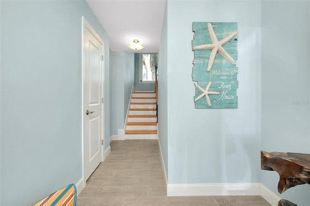 1001 Point Of Rocks Rd Unit 207, Sarasota, FL 34242 - hallway featuring baseboards, stairs, and a baseboard radiator