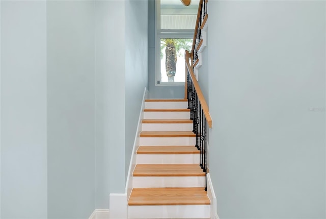 1001 Point Of Rocks Rd Unit 207, Sarasota, FL 34242 - staircase featuring baseboards