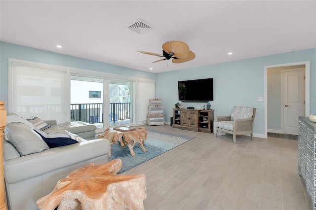 1001 Point Of Rocks Rd Unit 207, Sarasota, FL 34242 - living room featuring light wood-style flooring, ceiling fan, baseboards, and recessed lighting