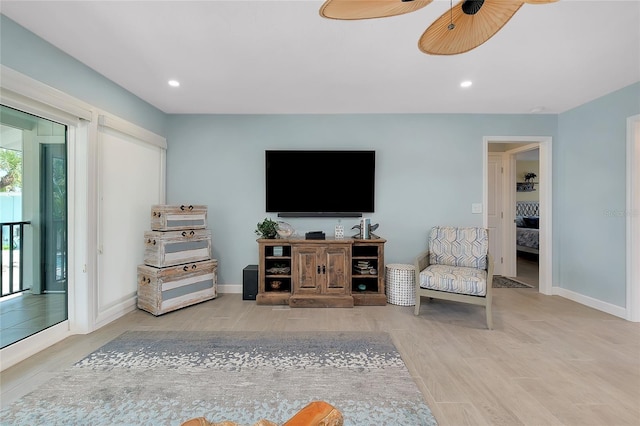 1001 Point Of Rocks Rd Unit 207, Sarasota, FL 34242 - living area featuring wood finished floors, a ceiling fan, baseboards, and recessed lighting