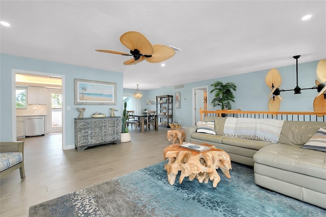 1001 Point Of Rocks Rd Unit 207, Sarasota, FL 34242 - living area featuring a ceiling fan, recessed lighting, healthy amount of natural light, and light wood-type flooring