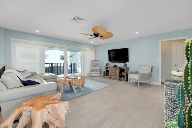 1001 Point Of Rocks Rd Unit 207, Sarasota, FL 34242 - living area with a ceiling fan, light wood-type flooring, baseboards, and recessed lighting
