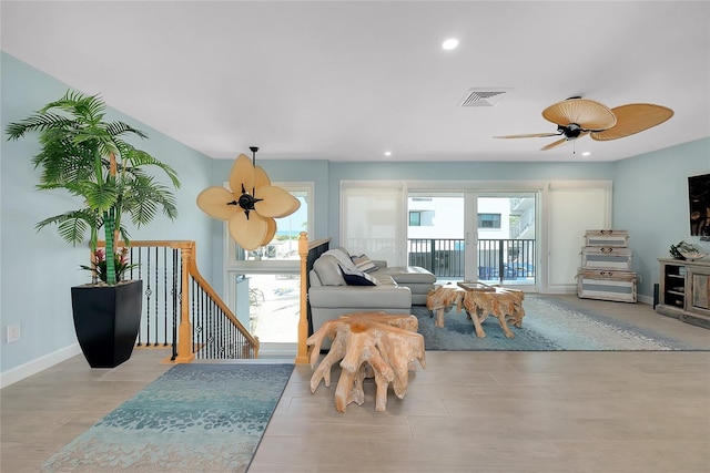 1001 Point Of Rocks Rd Unit 207, Sarasota, FL 34242 - living room featuring healthy amount of natural light, recessed lighting, baseboards, and ceiling fan