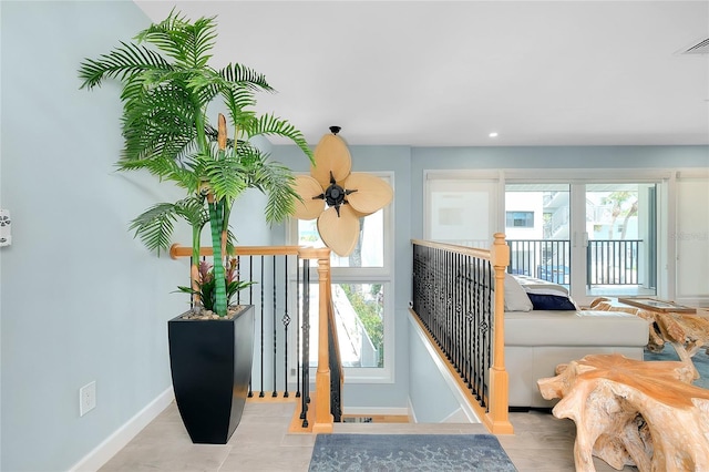 1001 Point Of Rocks Rd Unit 207, Sarasota, FL 34242 - stairway with baseboards and healthy amount of natural light