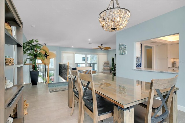 1001 Point Of Rocks Rd Unit 207, Sarasota, FL 34242 - dining area featuring a chandelier, light wood-style flooring, ceiling fan, and recessed lighting