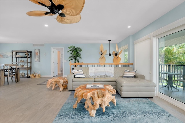 1001 Point Of Rocks Rd Unit 207, Sarasota, FL 34242 - living room with wood finished floors, recessed lighting, and a ceiling fan