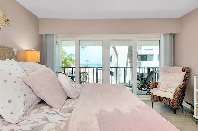 1001 Point Of Rocks Rd Unit 207, Sarasota, FL 34242 - bedroom featuring access to exterior and wood finished floors