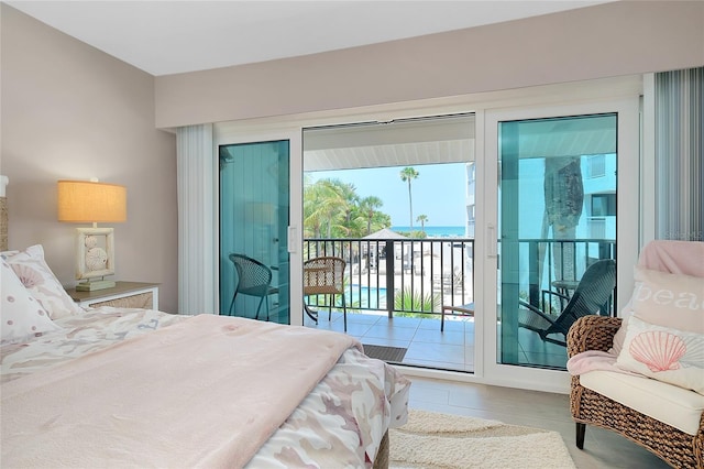 1001 Point Of Rocks Rd Unit 207, Sarasota, FL 34242 - bedroom with access to exterior and tile patterned flooring