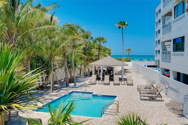 1001 Point Of Rocks Rd Unit 207, Sarasota, FL 34242 - community pool featuring a gazebo, a water view, and a patio area