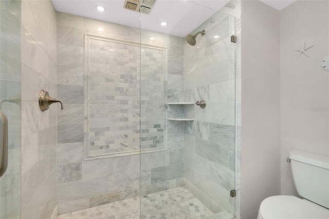 1001 Point Of Rocks Rd Unit 207, Sarasota, FL 34242 - bathroom featuring a stall shower, toilet, and recessed lighting