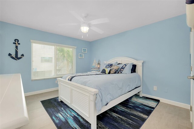 1001 Point Of Rocks Rd Unit 207, Sarasota, FL 34242 - bedroom featuring baseboards and a ceiling fan
