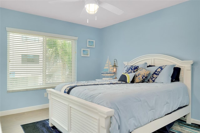 1001 Point Of Rocks Rd Unit 207, Sarasota, FL 34242 - bedroom featuring baseboards, ceiling fan, and wood finished floors