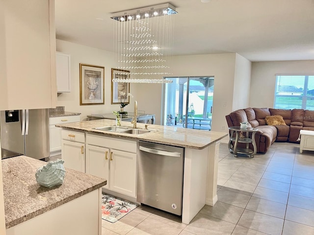 2410 Mizner Bay Ave, Bradenton, FL 34208 - kitchen featuring appliances with stainless steel finishes, a sink, plenty of natural light, and light tile patterned floors