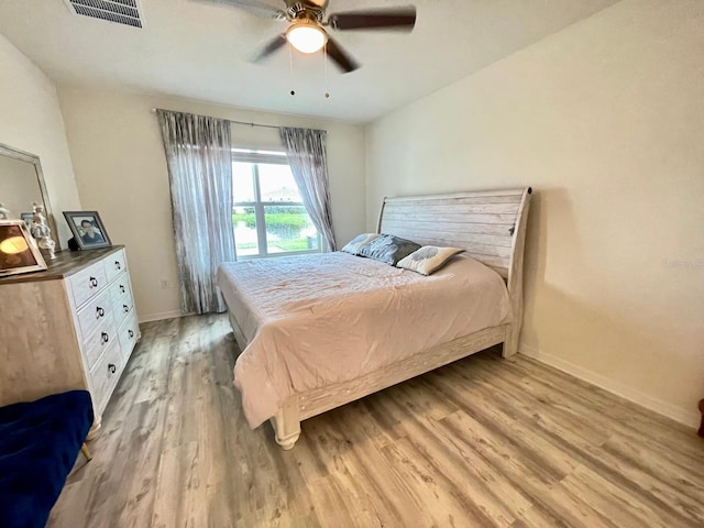 2410 Mizner Bay Ave, Bradenton, FL 34208 - bedroom with light wood-style floors, baseboards, and a ceiling fan