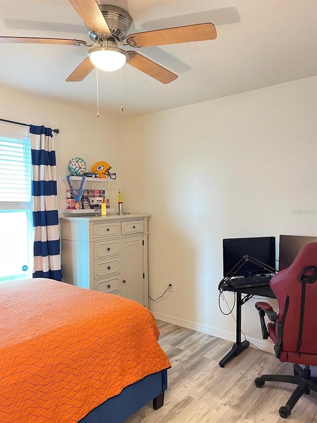 2410 Mizner Bay Ave, Bradenton, FL 34208 - bedroom with light wood-style flooring, ceiling fan, and baseboards