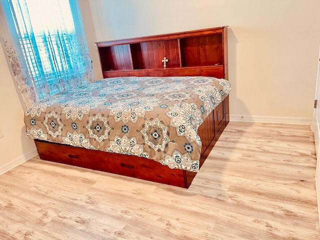2410 Mizner Bay Ave, Bradenton, FL 34208 - bedroom with wood finished floors and baseboards