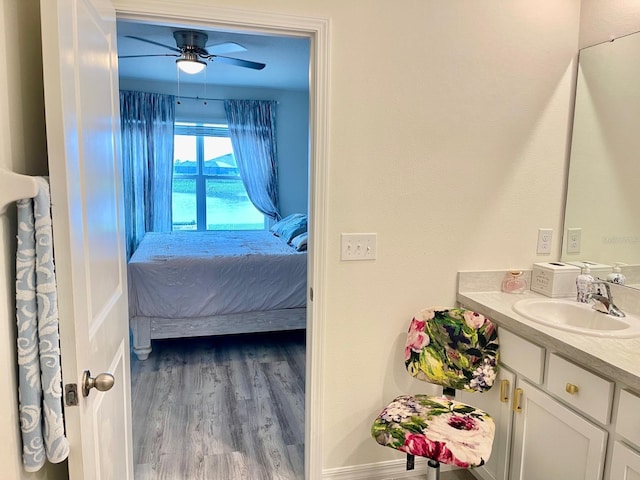 2410 Mizner Bay Ave, Bradenton, FL 34208 - bathroom with vanity, ceiling fan, and wood finished floors