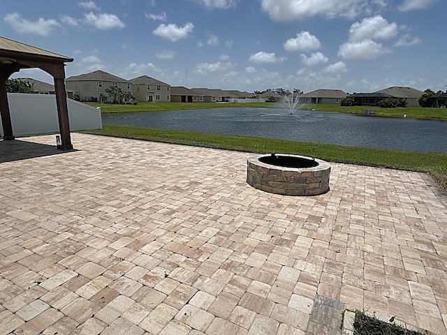 2410 Mizner Bay Ave, Bradenton, FL 34208 - view of patio featuring a water view, a residential view, a fire pit, and a gazebo