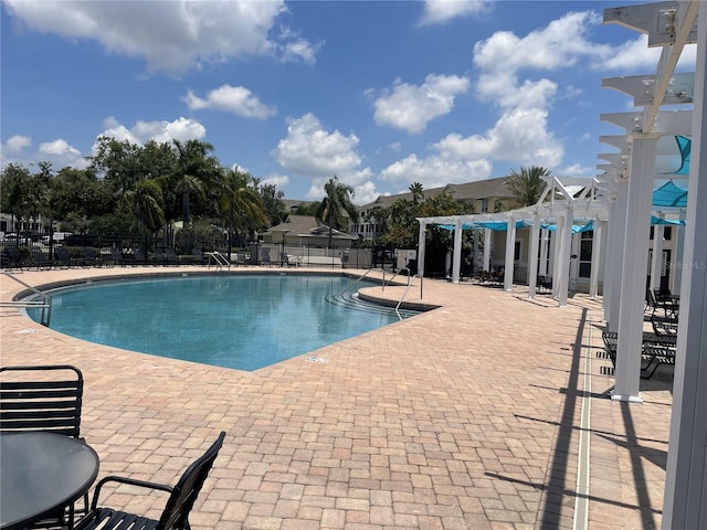 4802 51st St W Unit 1724, Bradenton, FL 34210 - community pool with a pergola and a patio area