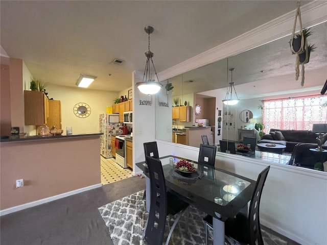 4802 51st St W Unit 1724, Bradenton, FL 34210 - dining area featuring light colored carpet and baseboards