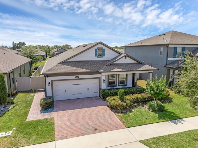 1896 Napoli Dr, Saint Cloud, FL 34771 - traditional-style home with a shingled roof, a garage, decorative driveway, stucco siding, and a residential view
