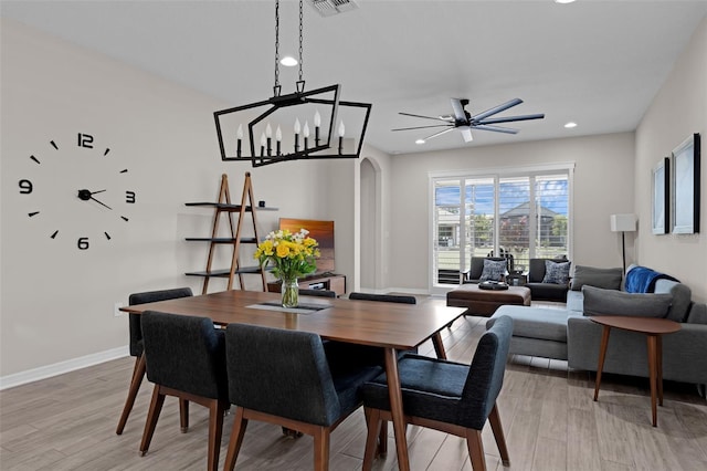 1896 Napoli Dr, Saint Cloud, FL 34771 - dining space with arched walkways, baseboards, recessed lighting, light wood-style floors, and a ceiling fan