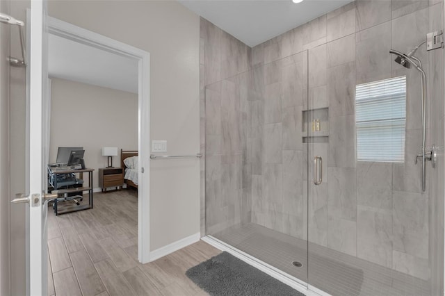 1896 Napoli Dr, Saint Cloud, FL 34771 - bathroom with a shower stall, wood finished floors, baseboards, and connected bathroom