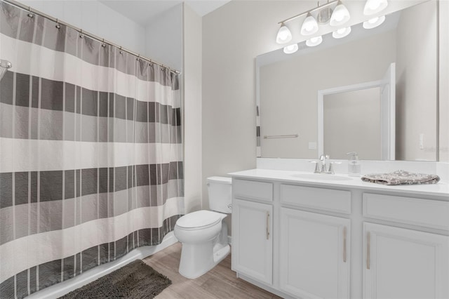 1896 Napoli Dr, Saint Cloud, FL 34771 - full bathroom featuring toilet, vanity, wood finished floors, and curtained shower