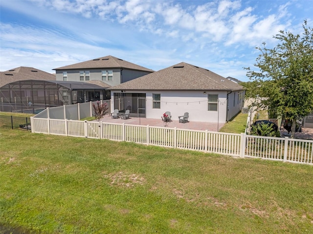 1896 Napoli Dr, Saint Cloud, FL 34771 - rear view of house featuring a patio area, stucco siding, roof with shingles, and a sunroom