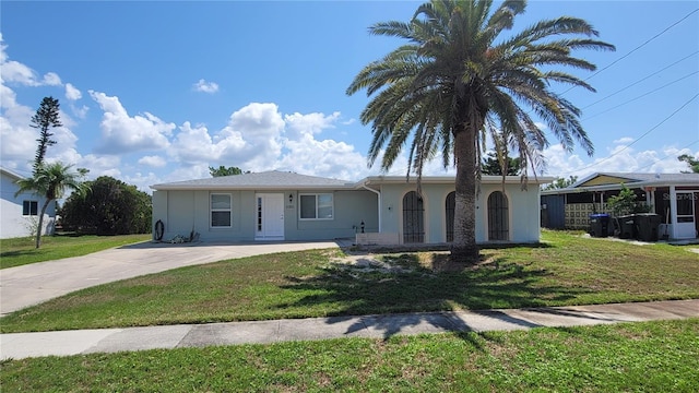 6360 Jordan St, North Port, FL 34287 - ranch-style house featuring a front lawn, stucco siding, and concrete driveway