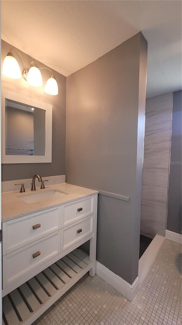 6360 Jordan St, North Port, FL 34287 - bathroom featuring vanity, baseboards, and tile patterned flooring