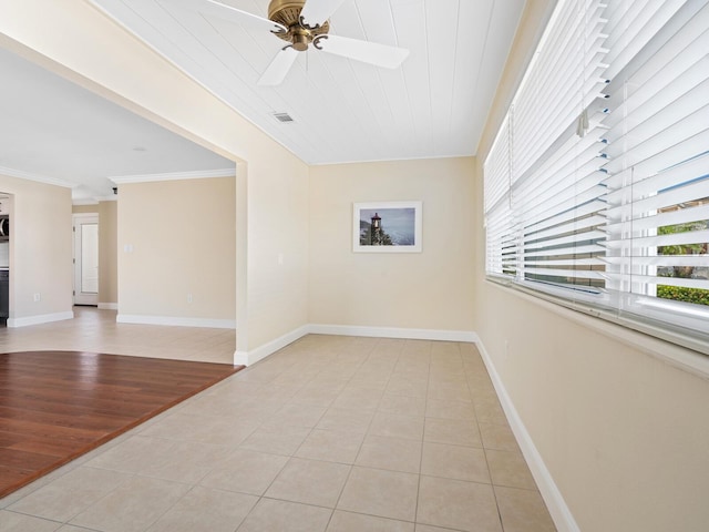 6300 Midnight Pass Rd Unit 5, Sarasota, FL 34242 - empty room with ornamental molding, light tile patterned floors, a ceiling fan, and baseboards