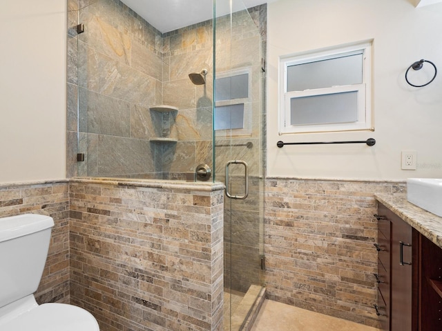6300 Midnight Pass Rd Unit 5, Sarasota, FL 34242 - full bathroom with tile walls, wainscoting, vanity, a shower stall, and toilet