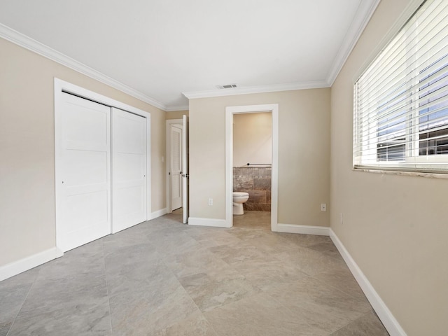 6300 Midnight Pass Rd Unit 5, Sarasota, FL 34242 - unfurnished bedroom with ornamental molding, a closet, ensuite bathroom, and baseboards