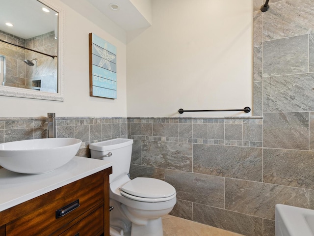 6300 Midnight Pass Rd Unit 5, Sarasota, FL 34242 - full bath featuring tile walls, toilet, a shower, vanity, and a wainscoted wall
