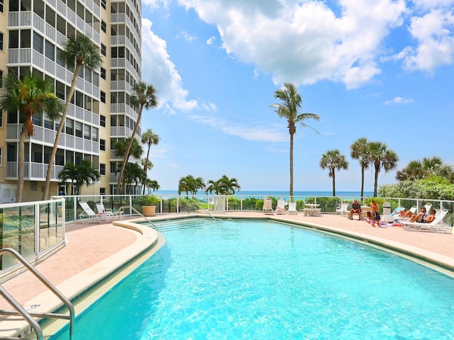 6300 Midnight Pass Rd Unit 5, Sarasota, FL 34242 - community pool featuring a patio area