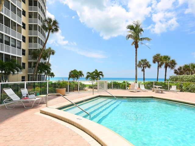 6300 Midnight Pass Rd Unit 5, Sarasota, FL 34242 - community pool featuring a patio and a water view