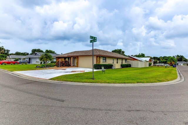 8402 13th Ave NW, Bradenton, FL 34209 - single story home featuring an attached garage, driveway, and a front lawn