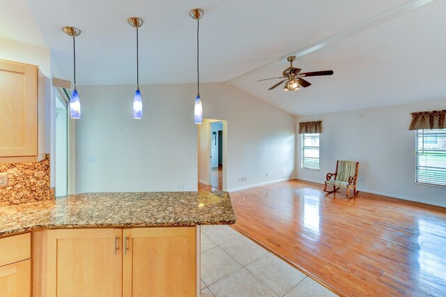 8402 13th Ave NW, Bradenton, FL 34209 - kitchen with light brown cabinets, open floor plan, a peninsula, ceiling fan, and lofted ceiling